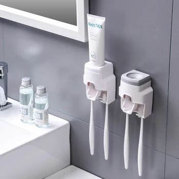 新しい北欧の白色の多機能な歯磨きスタンド穿孔無壁掛けの自動歯磨き粉ースクイザ掛けのラック